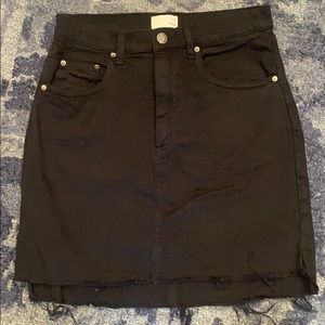 Stretch denim skirt with a raw cut hem/side slits